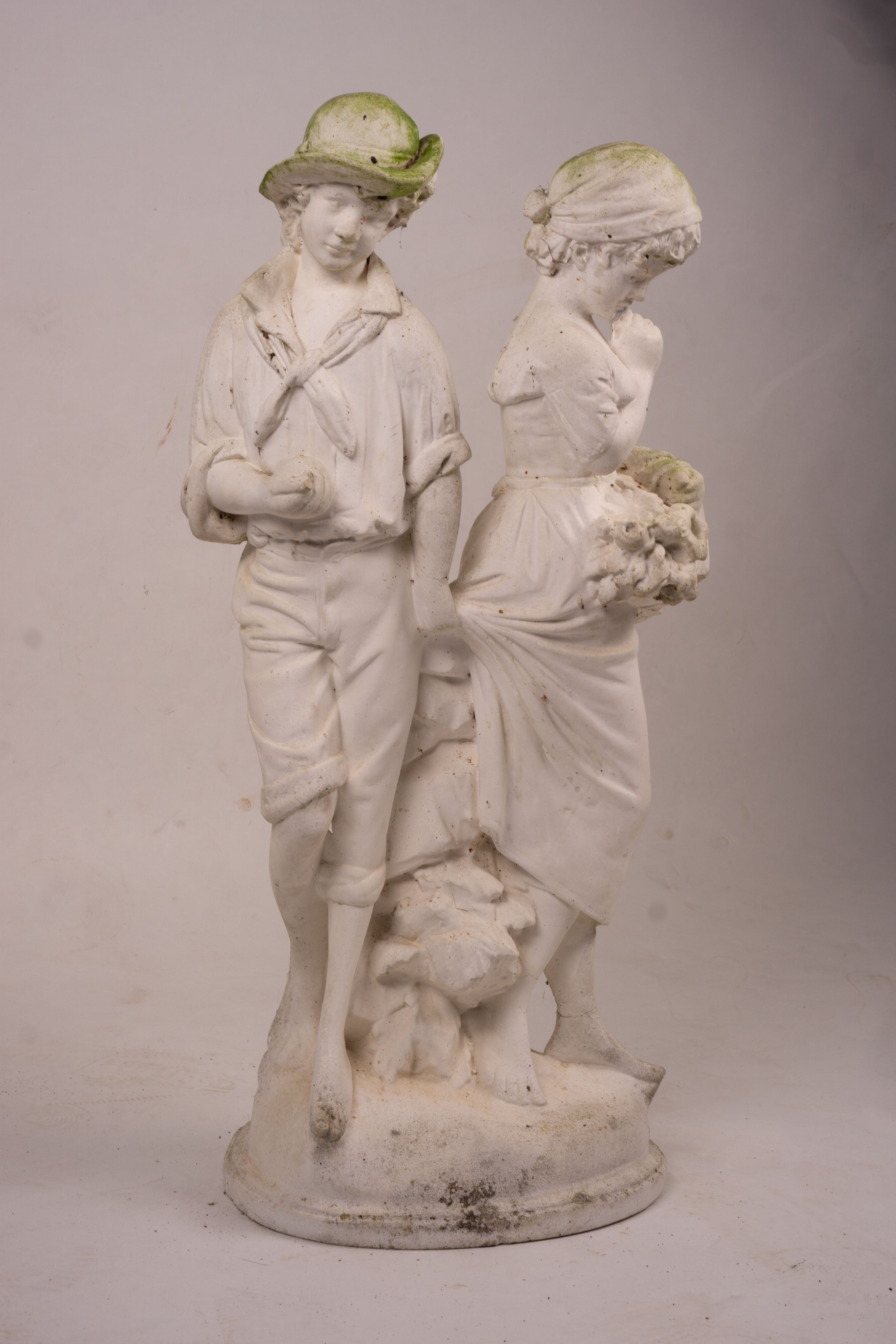 A reconstituted stone garden ornament of fruit and flower pickers, height 89cm